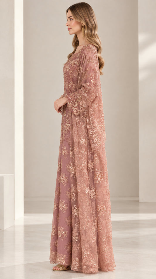Side profile view of dusty rose floral embroidered evening gown with flowing cape overlay