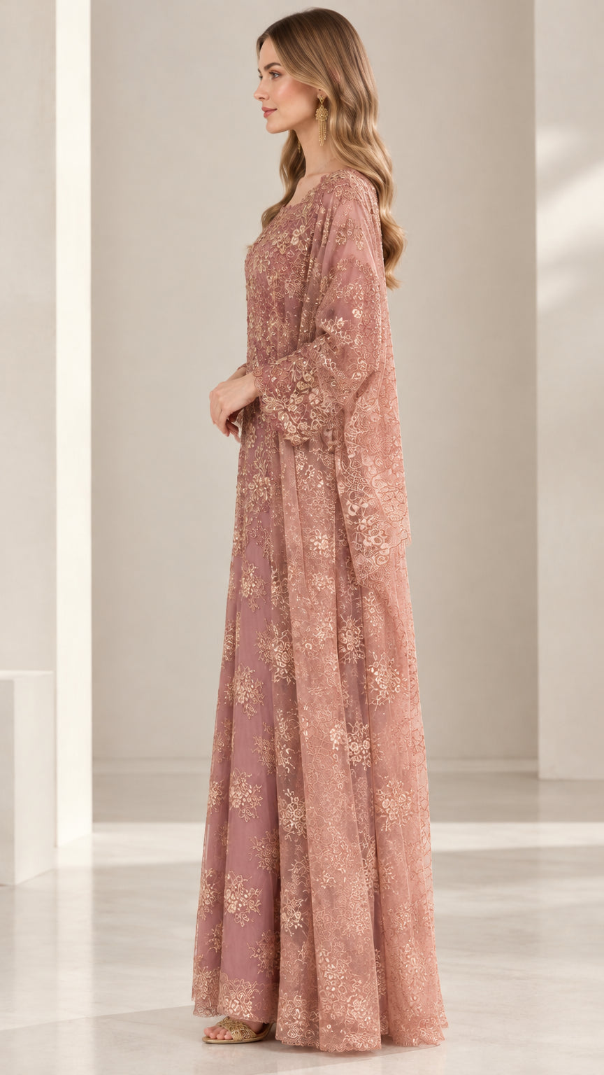 Side profile view of dusty rose floral embroidered evening gown with flowing cape overlay