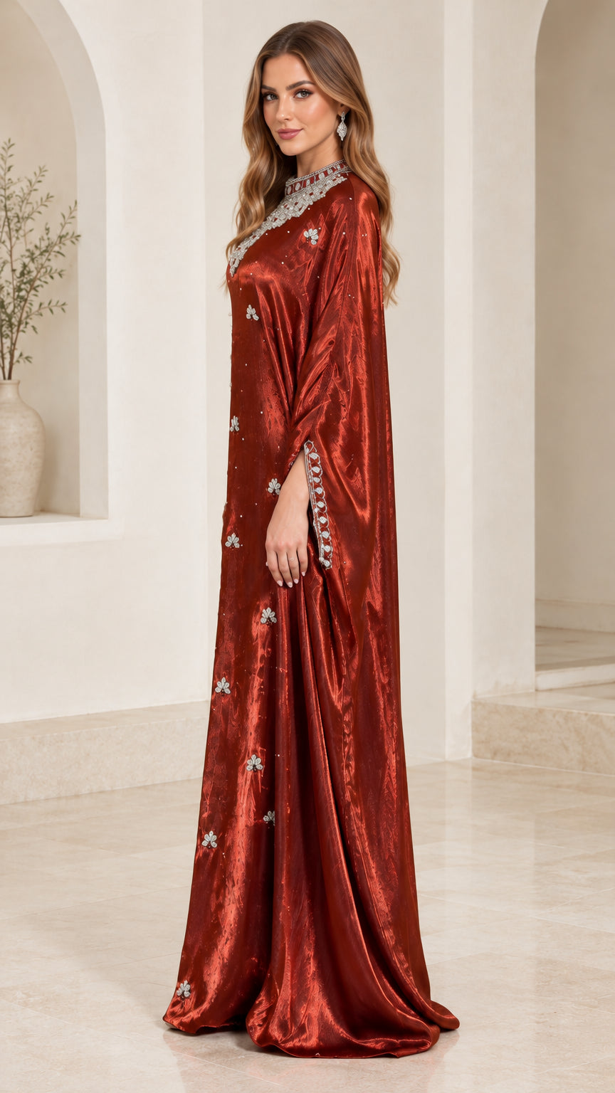 Side profile of rust red embellished kaftan dress showing elegant drape