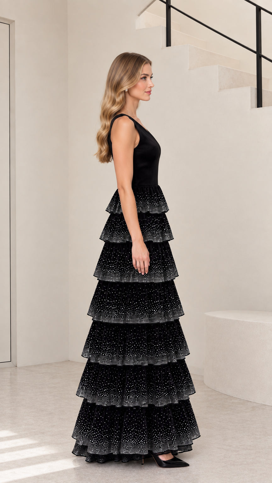 Side profile of black tiered rhinestone evening gown