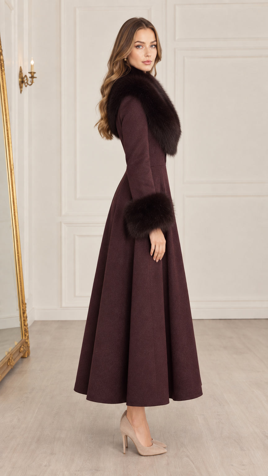 Side profile of model wearing burgundy long swing coat with plush faux fur trim