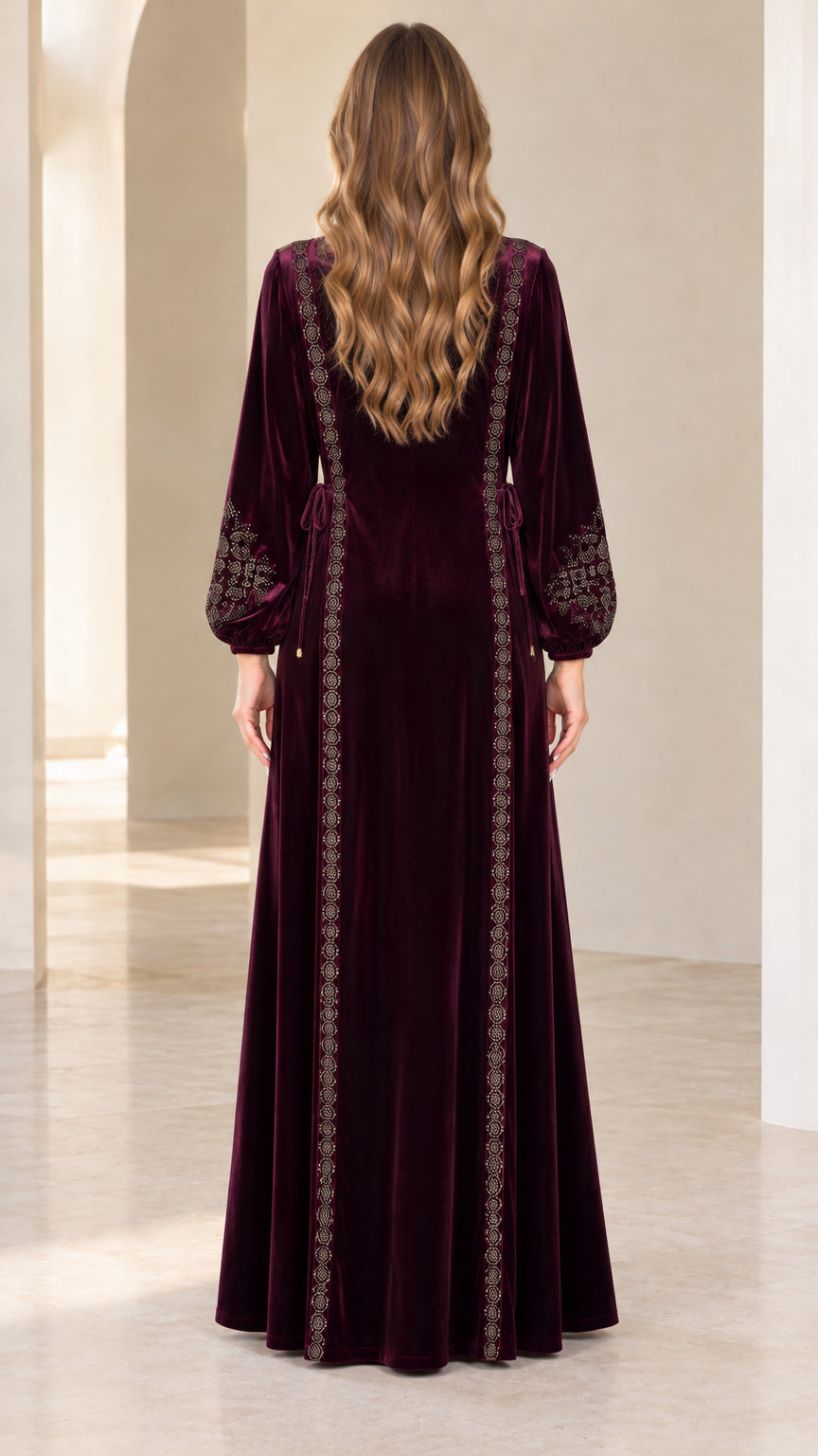 Back view of model wearing burgundy embroidered velvet maxi dress