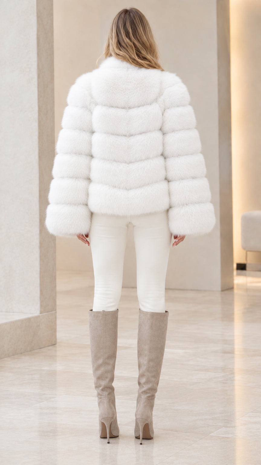 Rear view of woman wearing white horizontal banded faux fur winter jacket