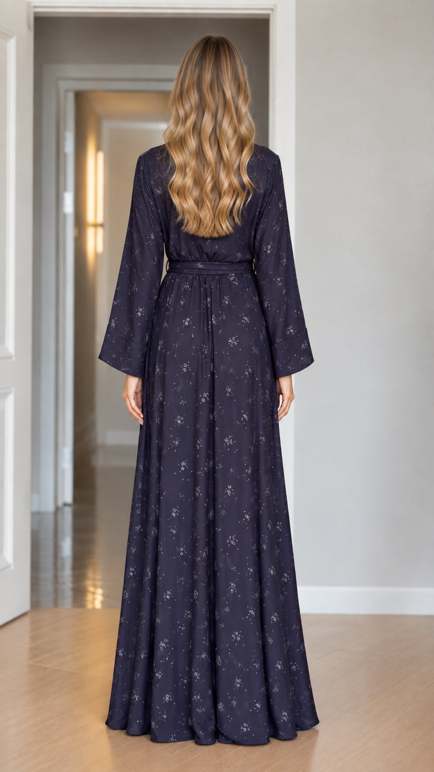 Back view of model in Navy Blue floral maxi dress with tied waist sash
