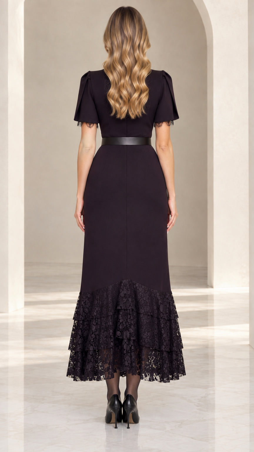 Back view of black flutter sleeve midi dress showing sleek fit and lace hem