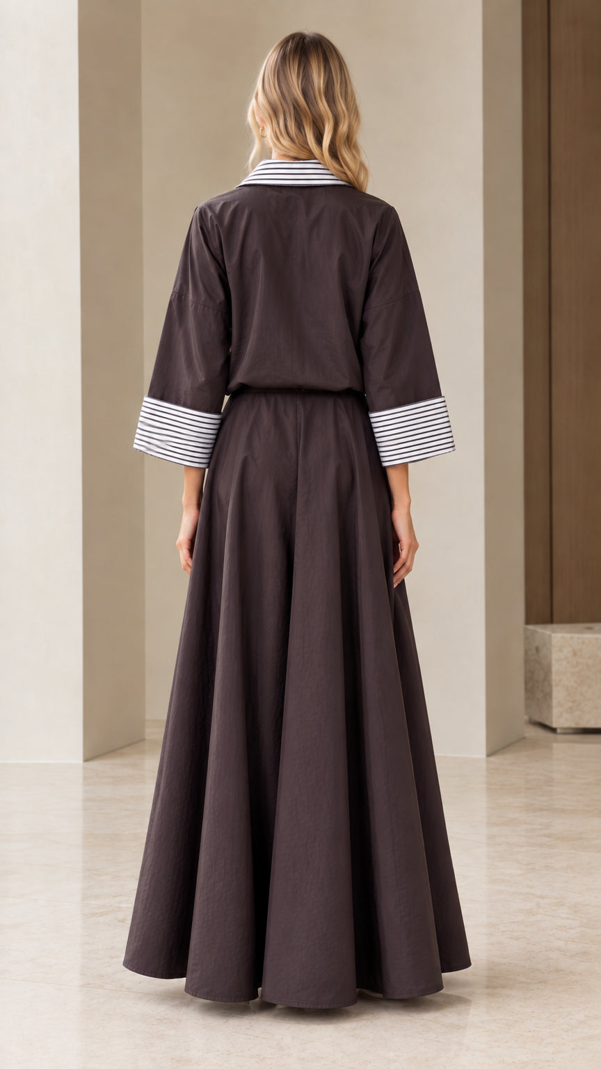Back view of woman in charcoal long sleeve shirt and maxi skirt set