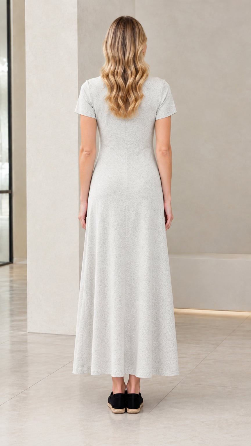 Back full-length view of woman wearing Heather Grey maxi dress showing clean A-line silhouette