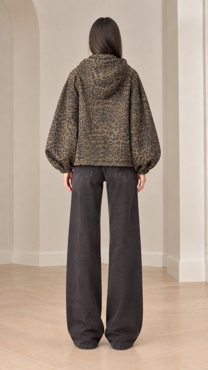 Back view of model wearing brown leopard print hooded jacket showcasing balloon sleeve volume