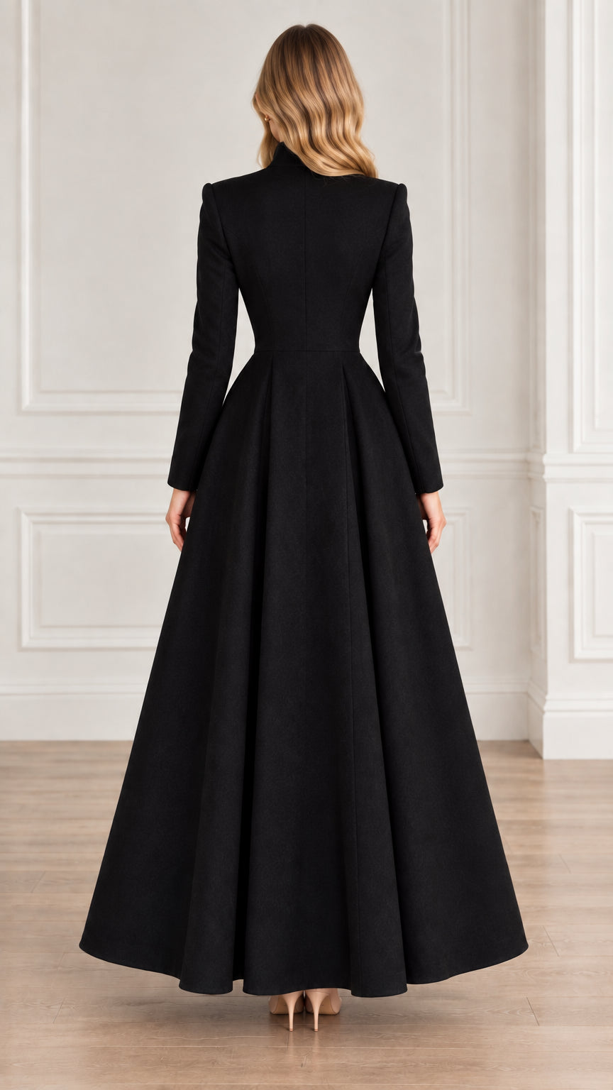 Back view of black tailored longline maxi coat showing fitted waist and flared hem