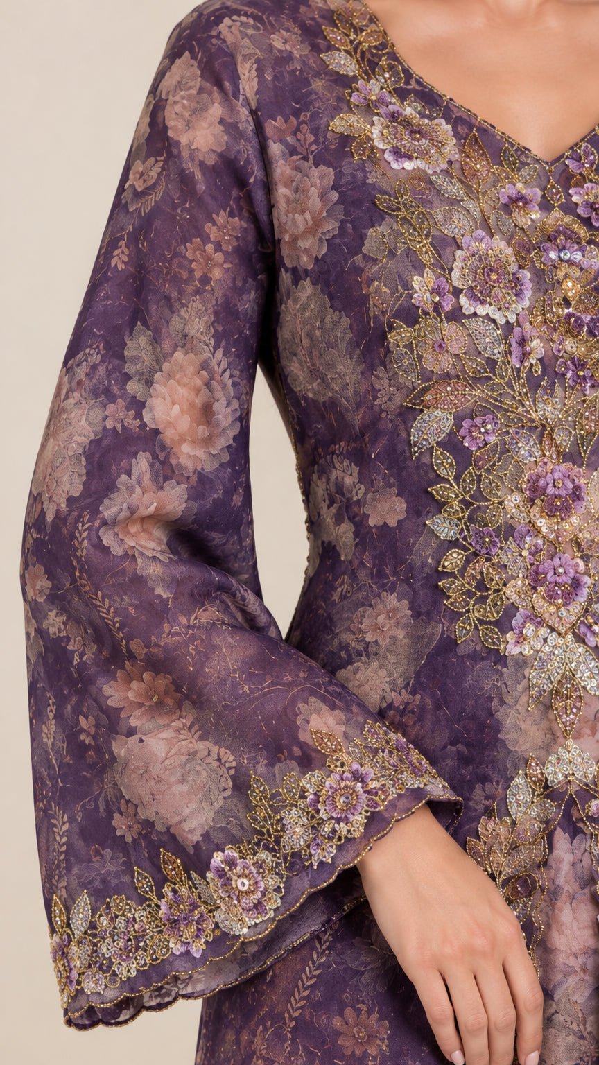 Close-up detail of intricate embroidery and flared sleeve on purple dress