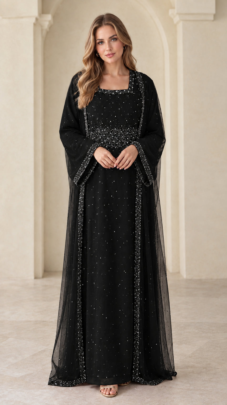 Front view of model wearing black beaded layered abaya maxi dress