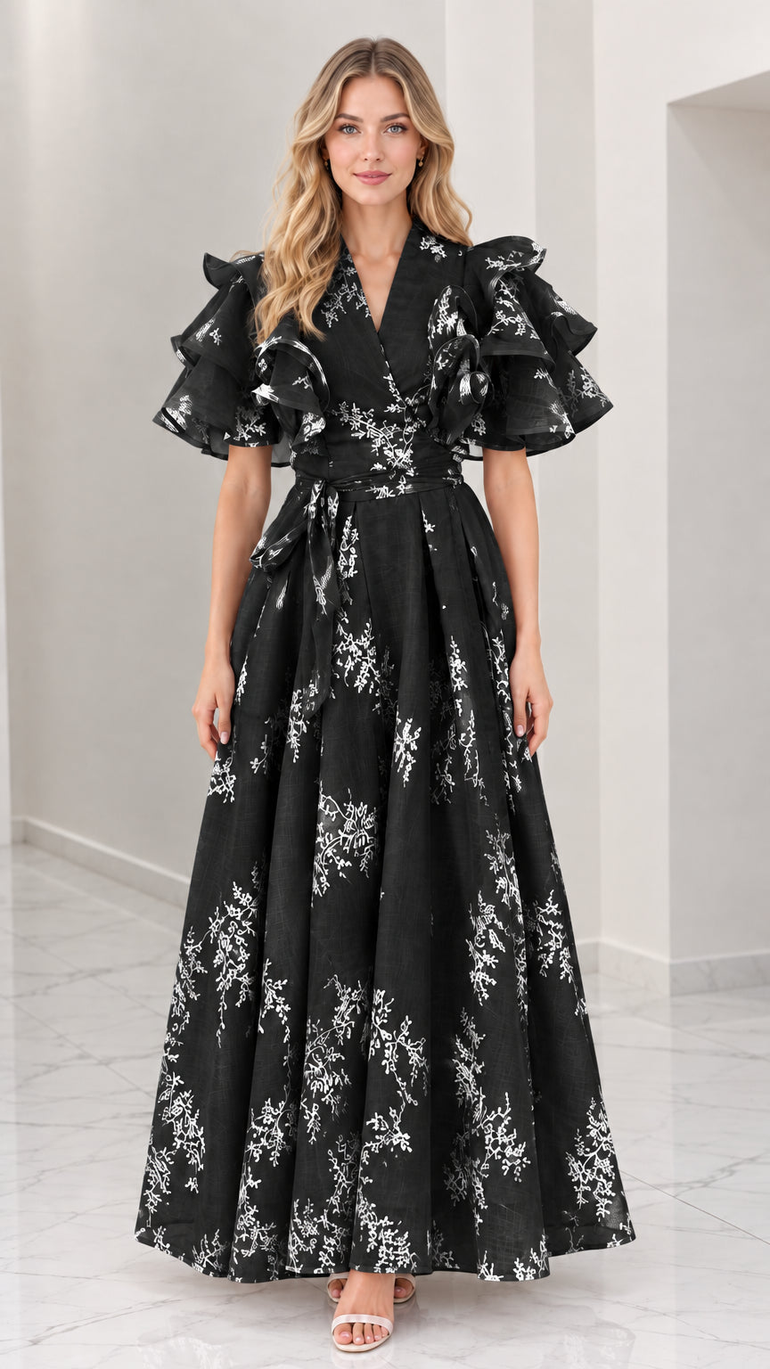 Front full-length view of black floral embroidered maxi dress with tiered ruffle sleeves