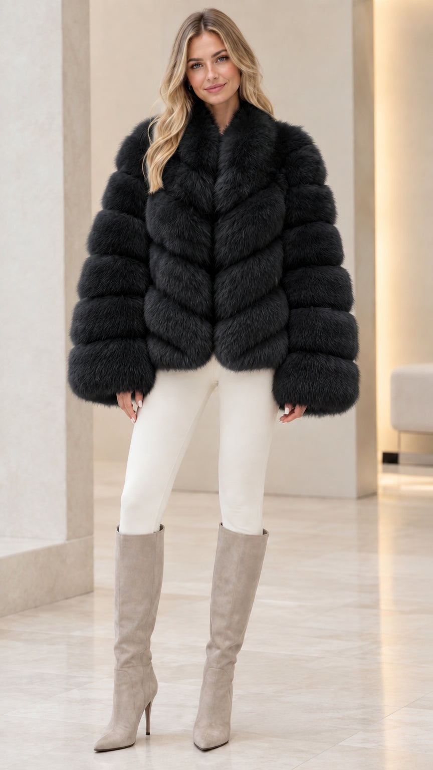 Model wearing black ribbed faux fur jacket with white pants and high-heel boots