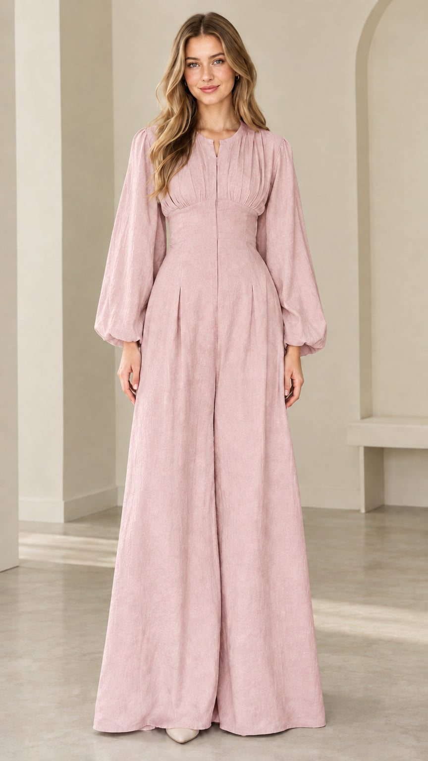 Model wearing dusty pink long sleeve palazzo jumpsuit