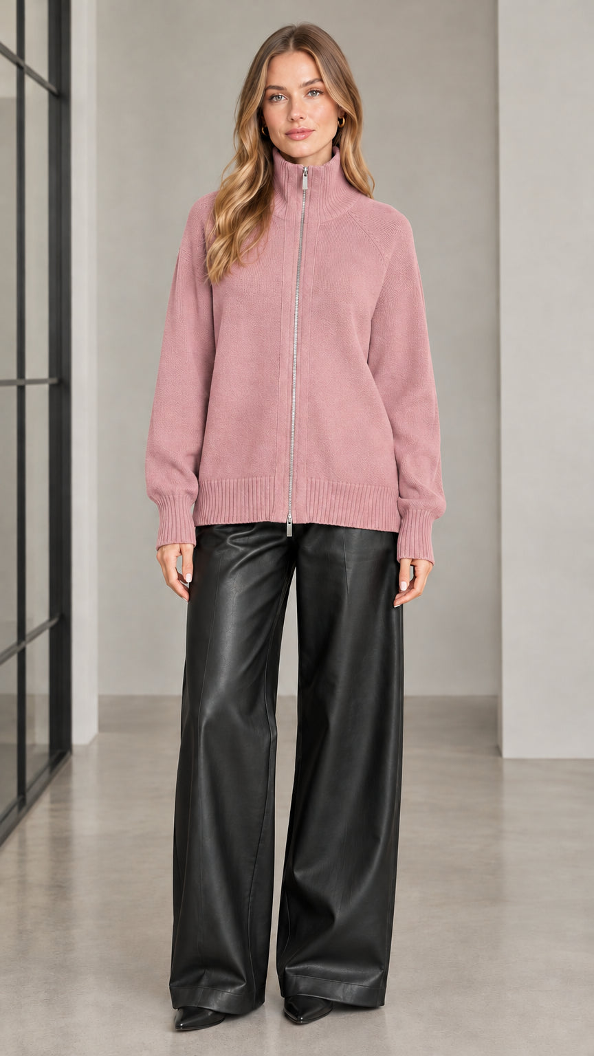 Front view of woman wearing dusty pink full zip knit cardigan