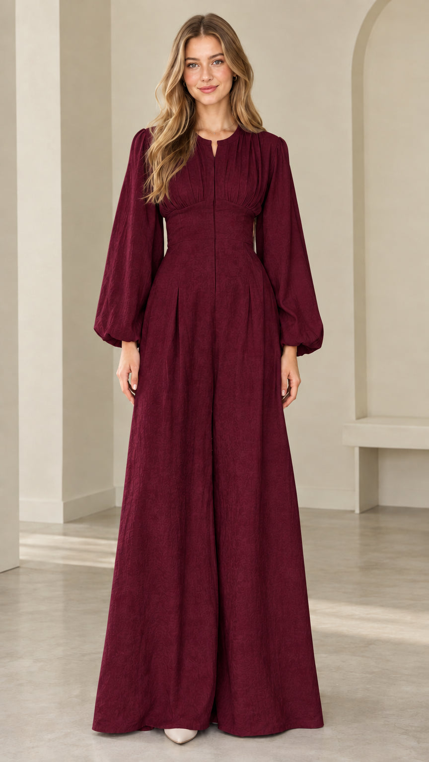 Model wearing burgundy wine red long sleeve evening jumpsuit