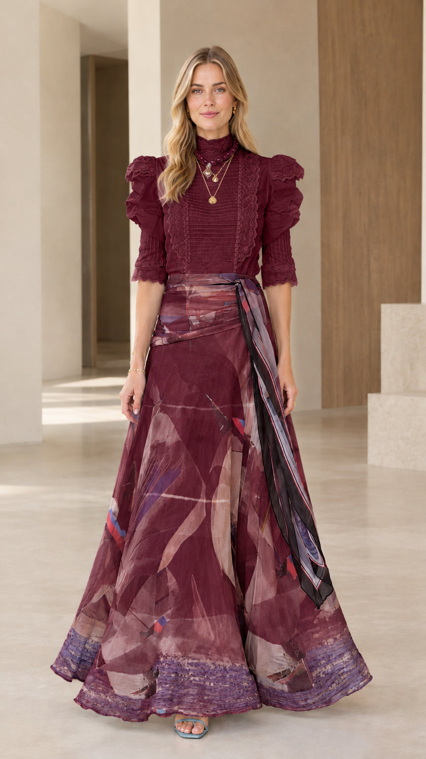 Full-length view of burgundy high-neck top and rich wine-colored watercolor maxi skirt