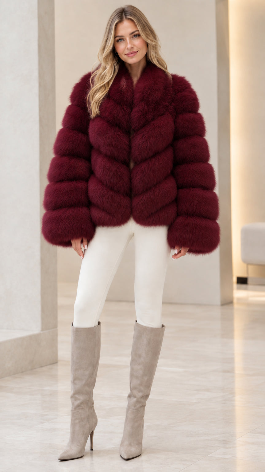 Model wearing rich burgundy wine red faux fur jacket with tall beige boots