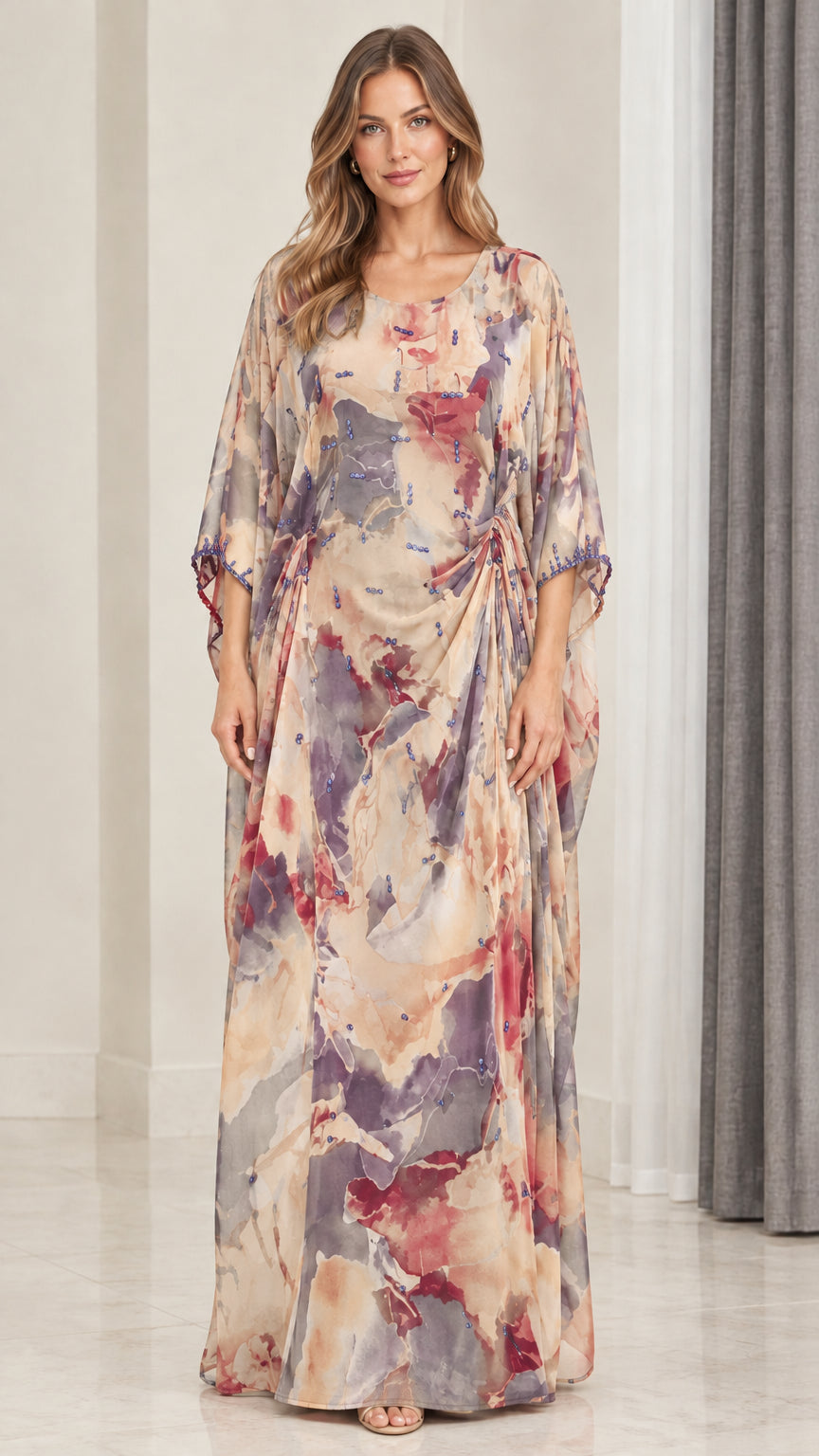 Front view of model wearing champagne multi watercolor draped kaftan maxi dress
