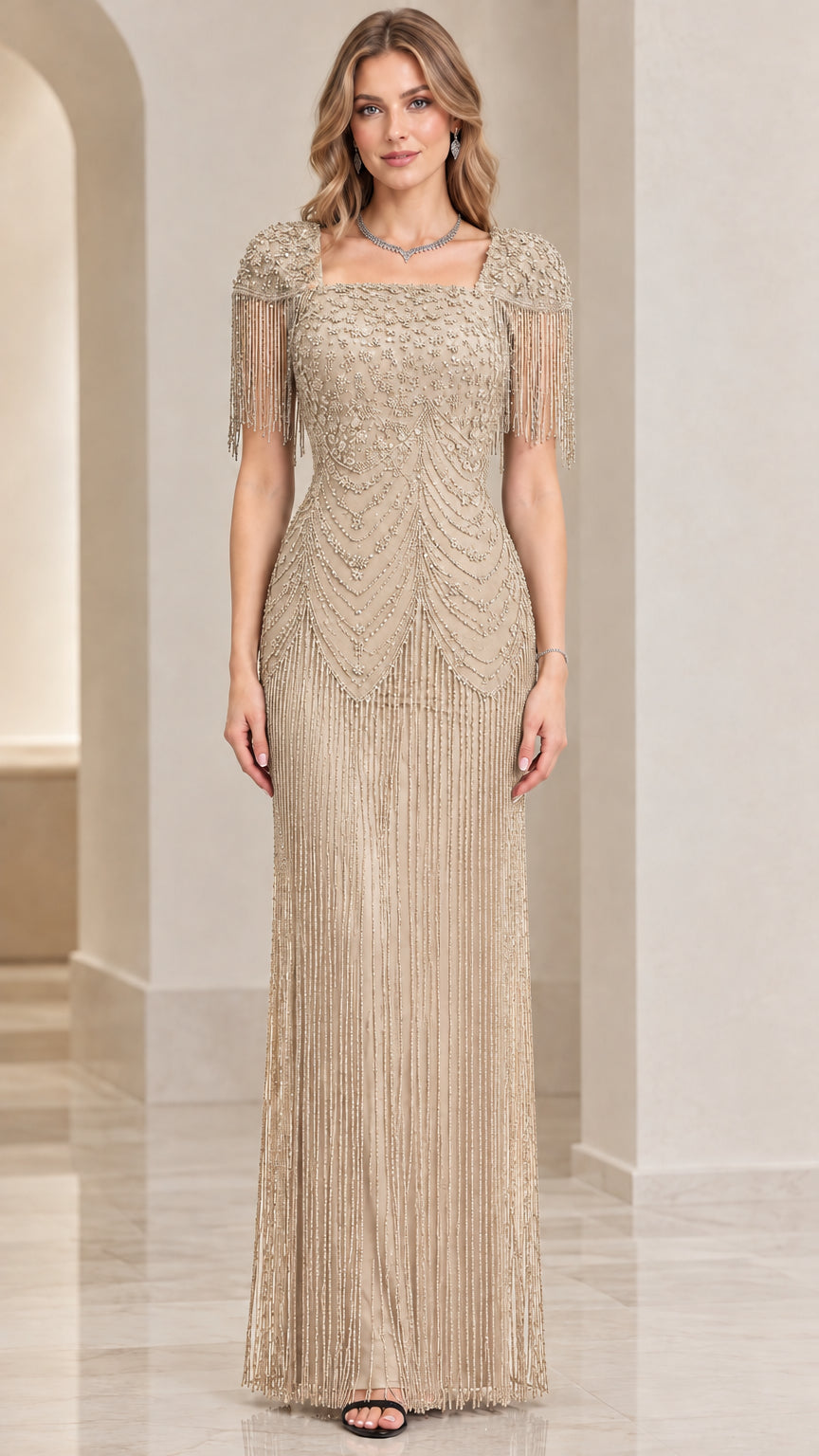 Front view of champagne gold beaded evening gown with fringe overlay