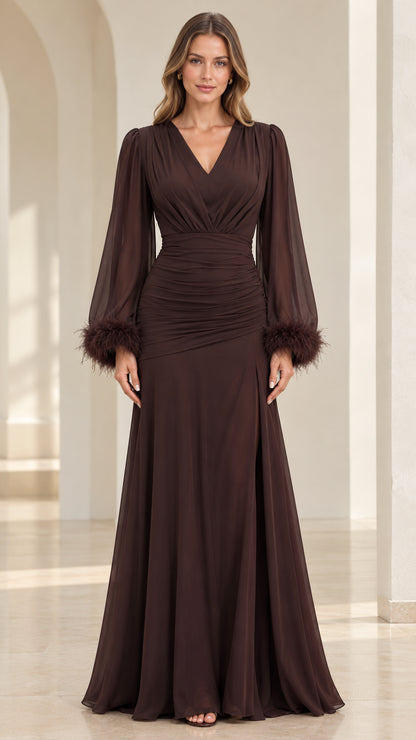 Front view of model wearing floor-length chocolate brown ruched evening gown with feather cuffs