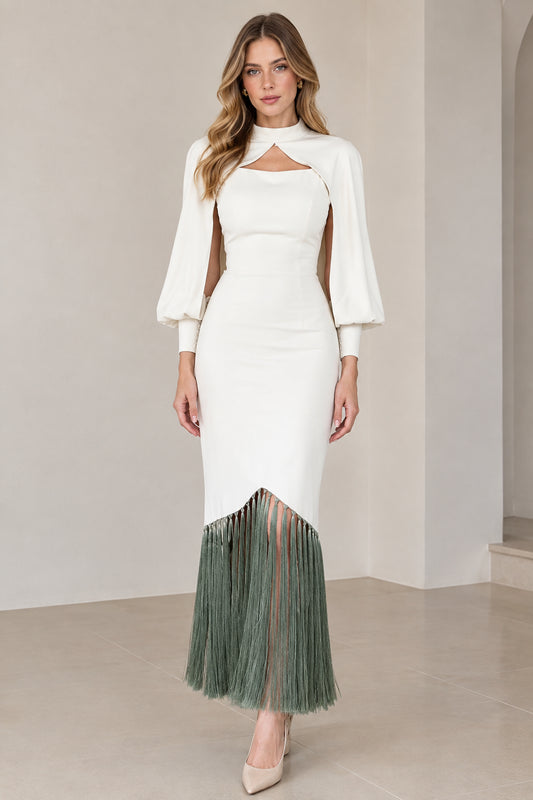 Full front view of model wearing white bodycon midi dress with sage green fringe hem and cape sleeves