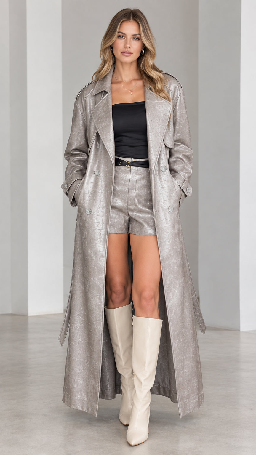 Full-length front view of model wearing metallic silver croc-embossed maxi trench coat