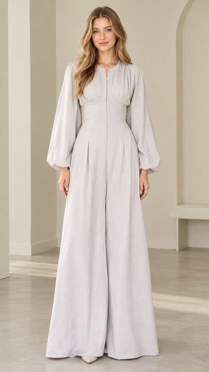 Front view of model wearing dove grey lantern sleeve wide leg jumpsuit