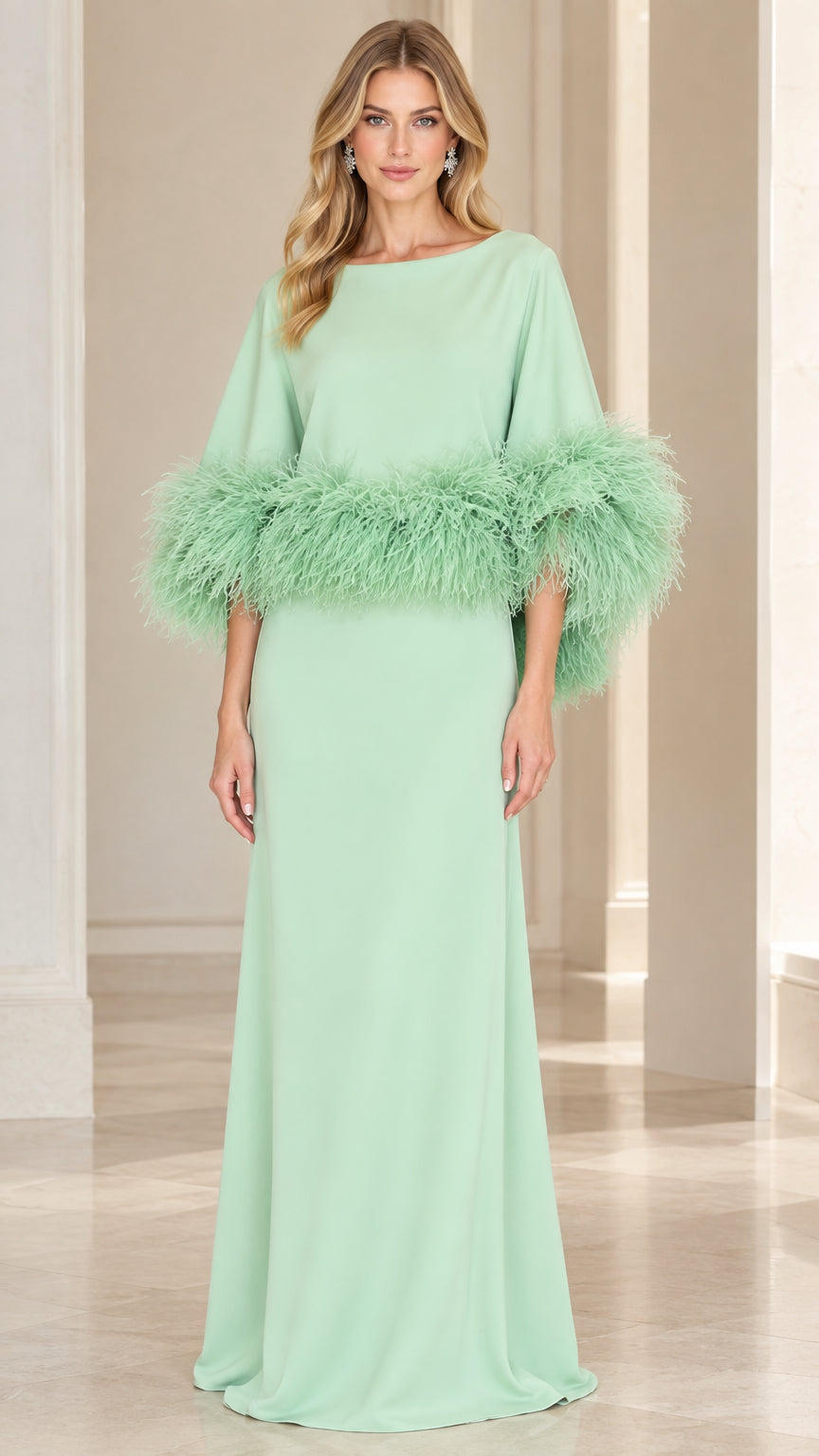 Front full-length view of model wearing mint green feather-trim cape sleeve maxi evening dress