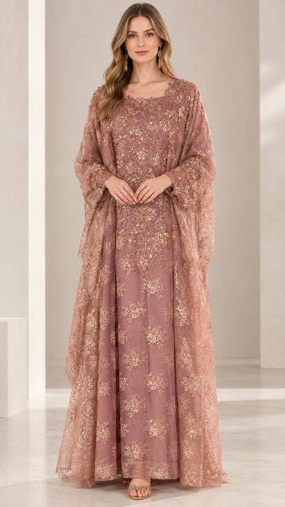 Full front view of model wearing dusty rose embroidered sequin kaftan maxi dress with cape sleeves