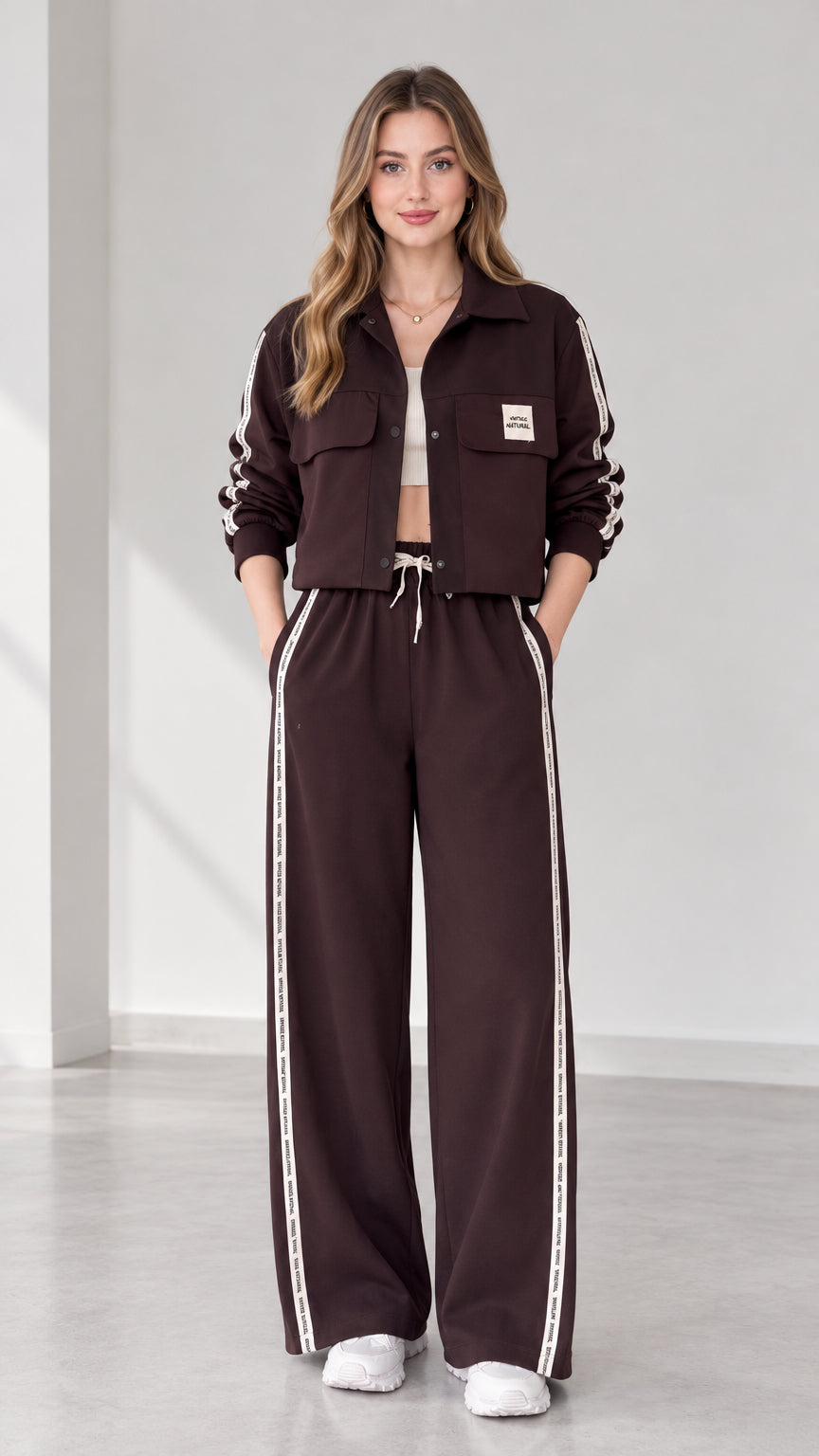 Front full view of women's cropped jacket and wide-leg track pants set in dark brown