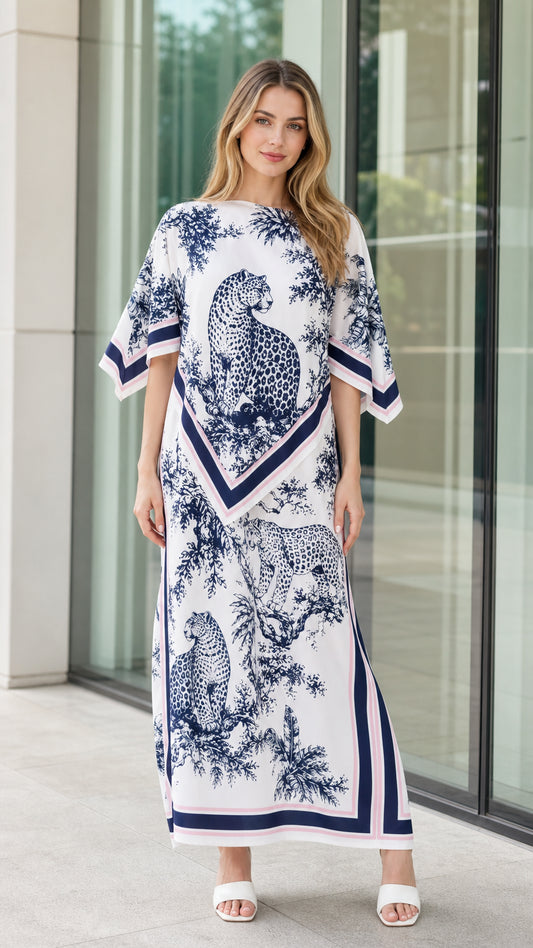 Front view of woman wearing white and navy leopard scarf print kaftan maxi dress