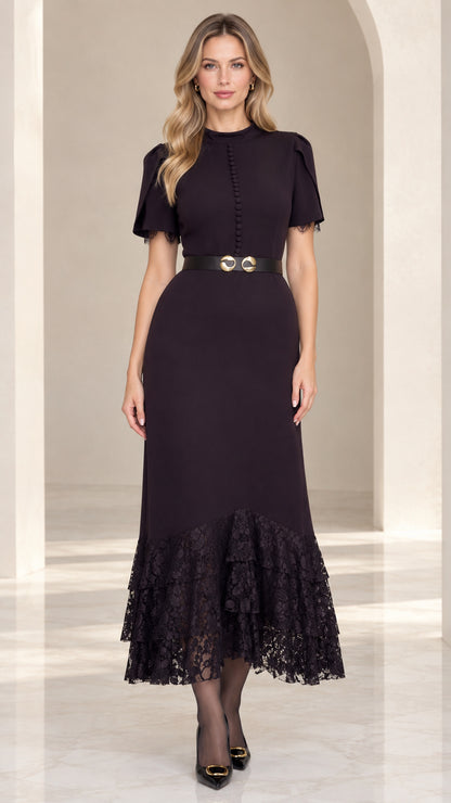 Front full-length view of model wearing black lace hem midi dress with belt