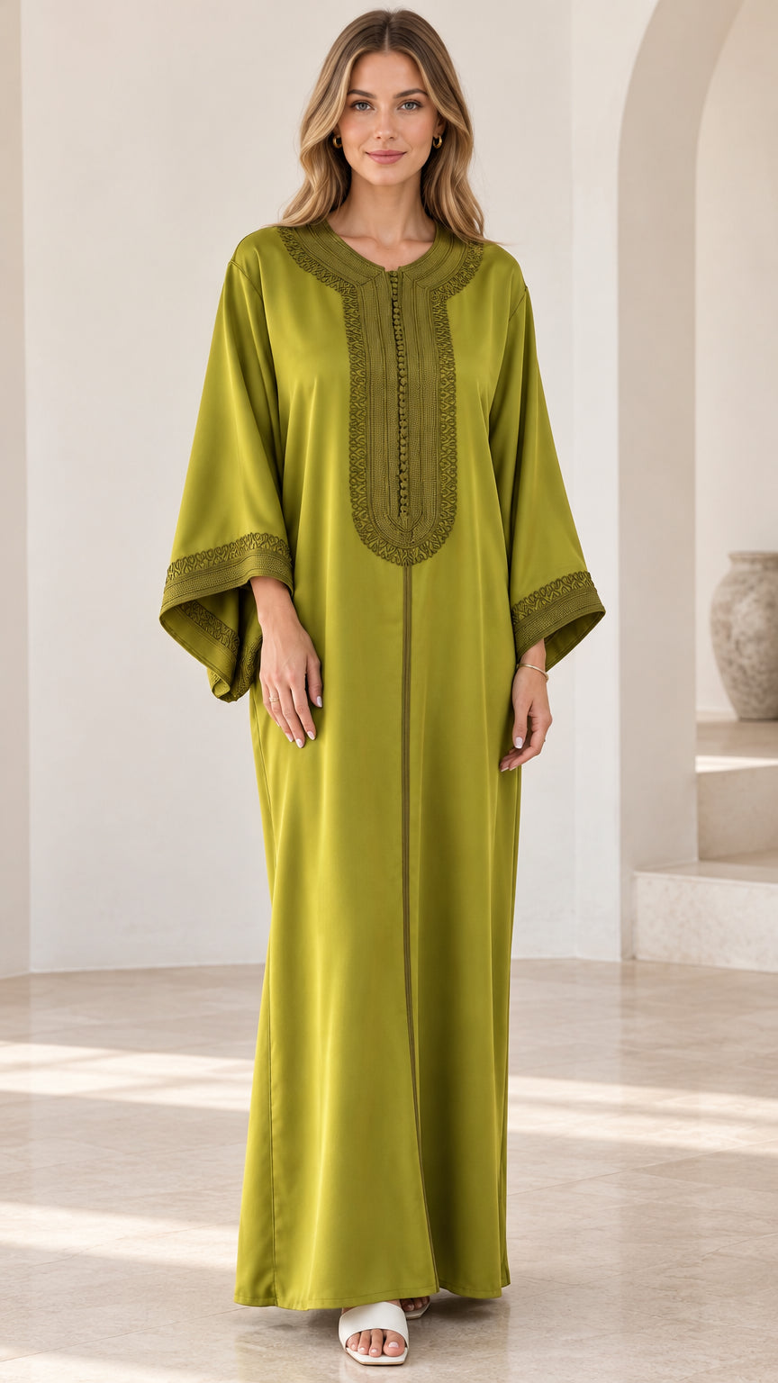 Front full-length view of woman wearing olive green embroidered kaftan maxi dress