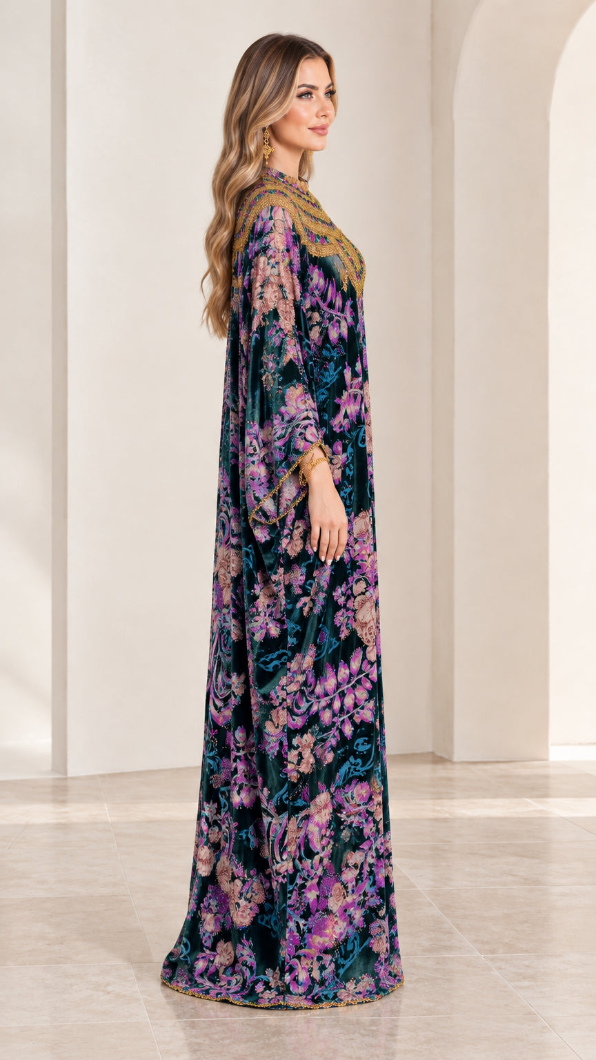 Side profile view of model in Teal floral velvet kaftan maxi dress