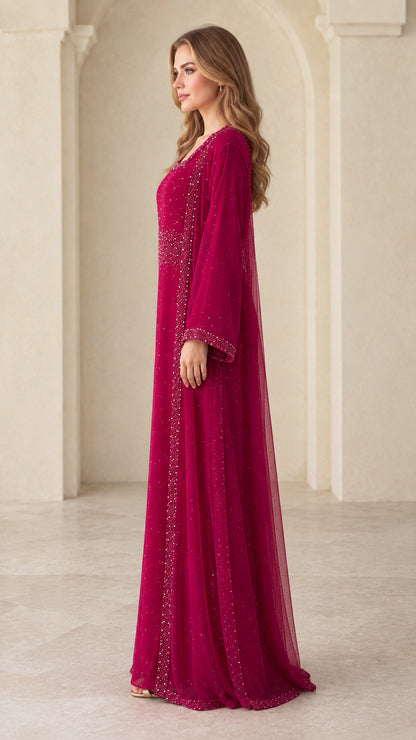 Side profile view of woman modeling berry long sleeve evening abaya gown