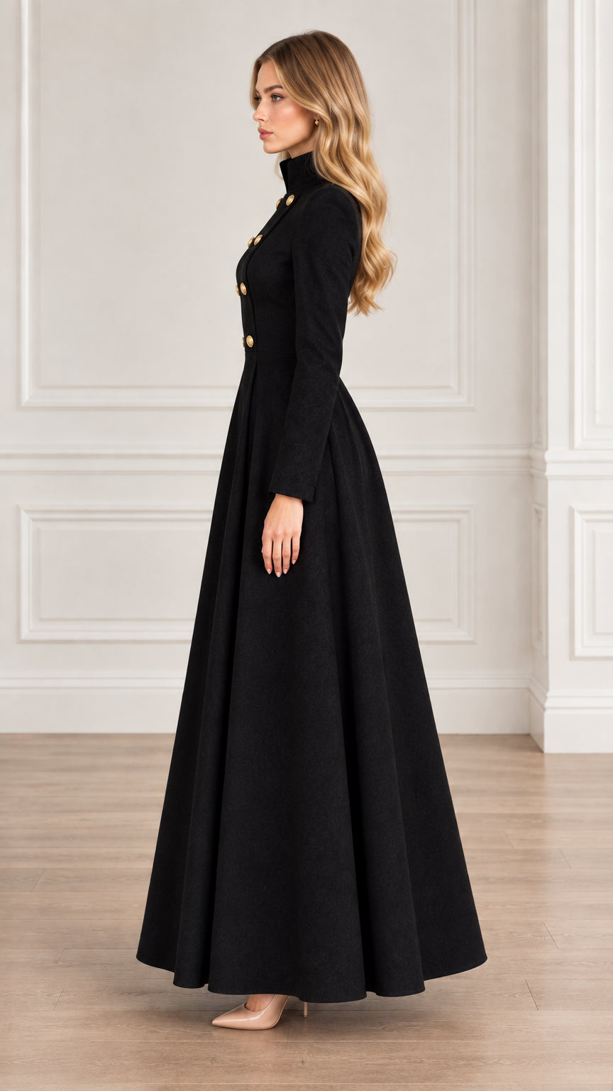 Side profile view of woman wearing black long flared military maxi coat