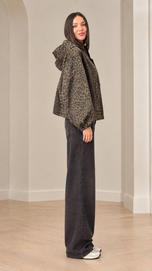 Side profile of model wearing brown leopard print jacket with hood and lantern sleeves