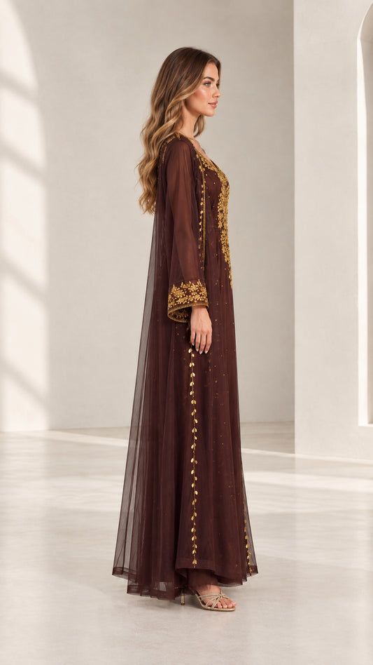 Side profile view of woman wearing chocolate brown embroidered kaftan maxi dress