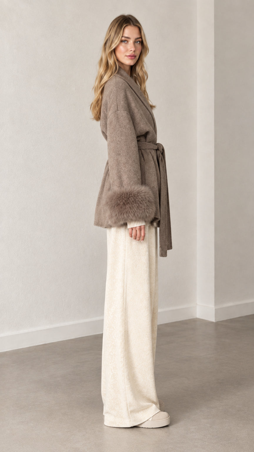 Side profile view of taupe short wrap coat with plush fur cuffs