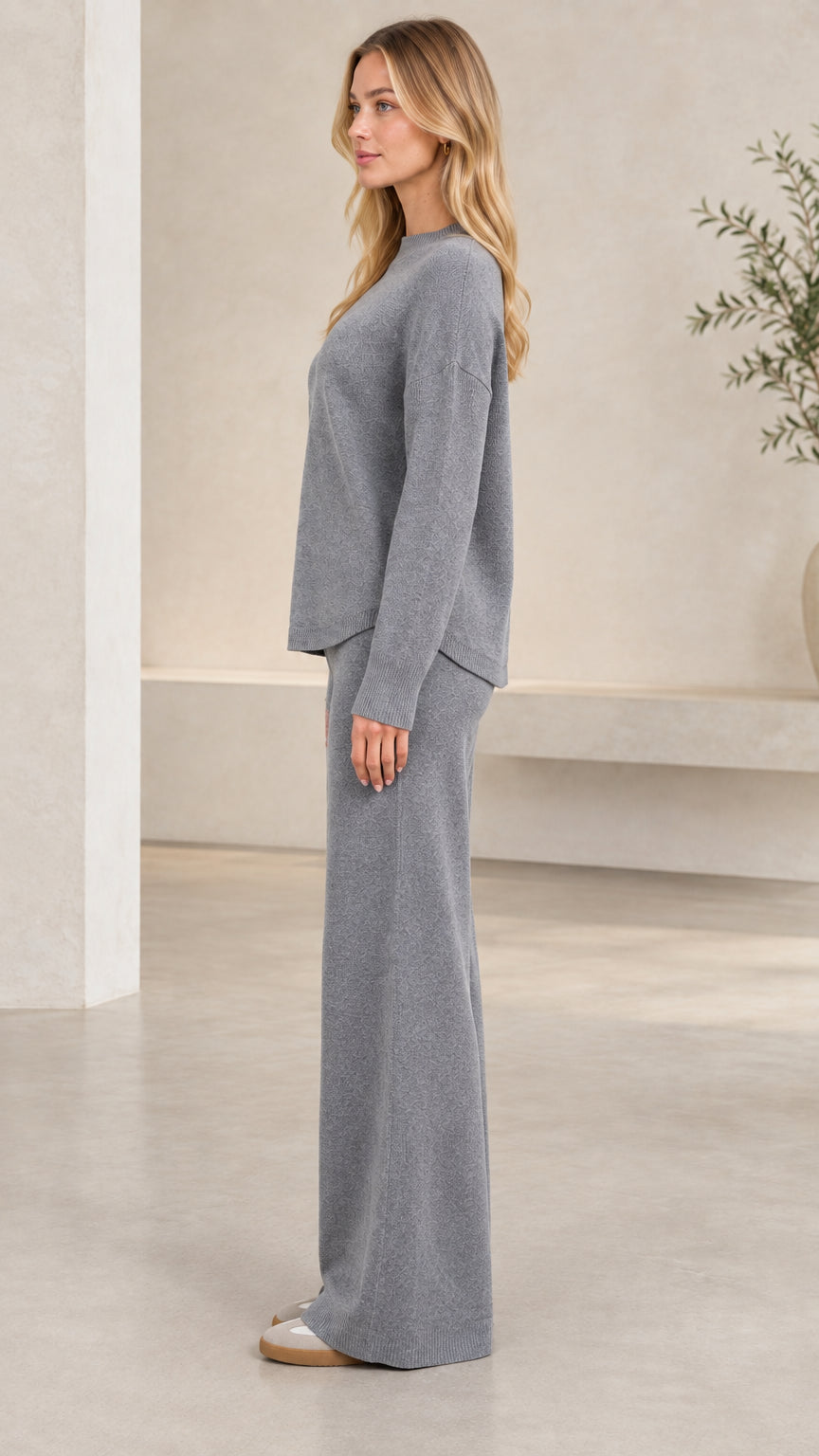 Side view of model wearing heather grey relaxed knit lounge set