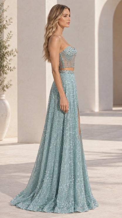 Side profile of model wearing dusty blue two-piece formal dress with sweetheart bustier