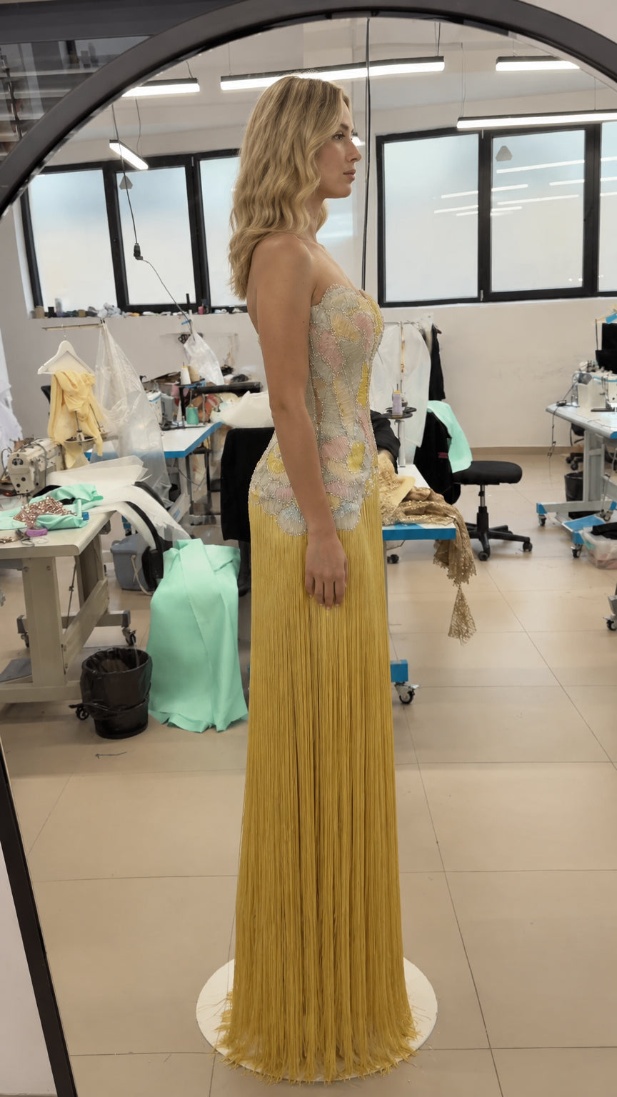 Side profile view of model in the yellow beaded fringe formal maxi dress