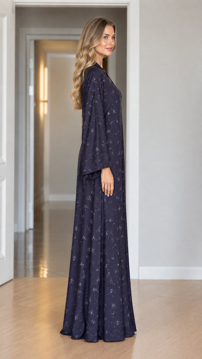 Side angle view of model wearing Navy Blue floral maxi dress