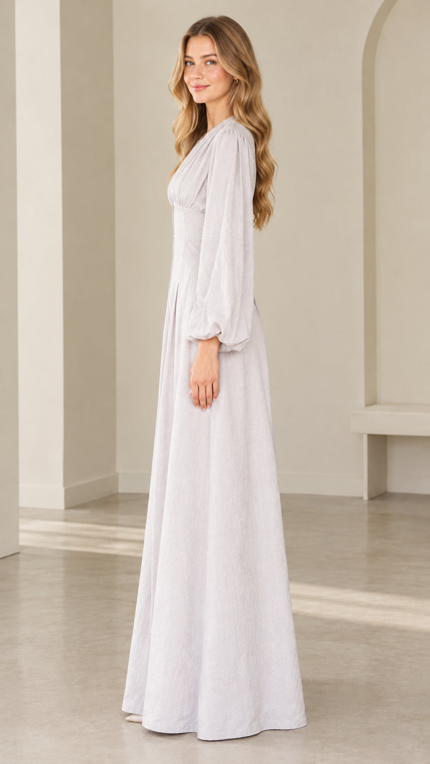 Side profile view of dove grey long sleeve wide leg formal jumpsuit