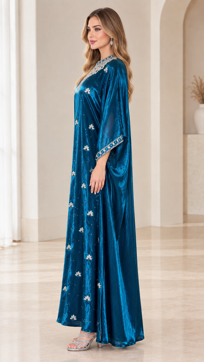 Side profile view of teal blue velvet kaftan maxi dress highlighting relaxed drape