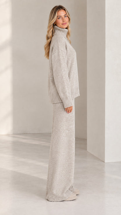 Side profile view of women wearing heather grey knit lounge set