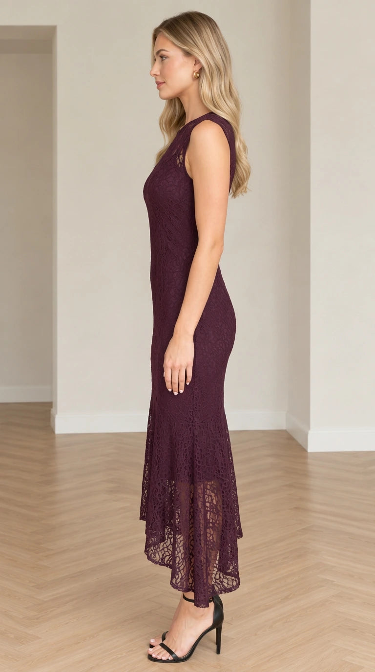 Side profile of model wearing plum asymmetrical floral lace cocktail dress