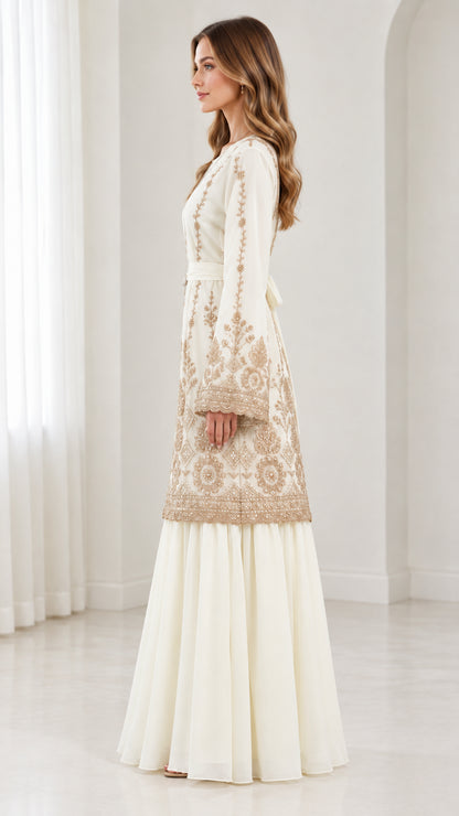 Side full-length profile of ivory embroidered tunic and flowing maxi skirt with tied sash