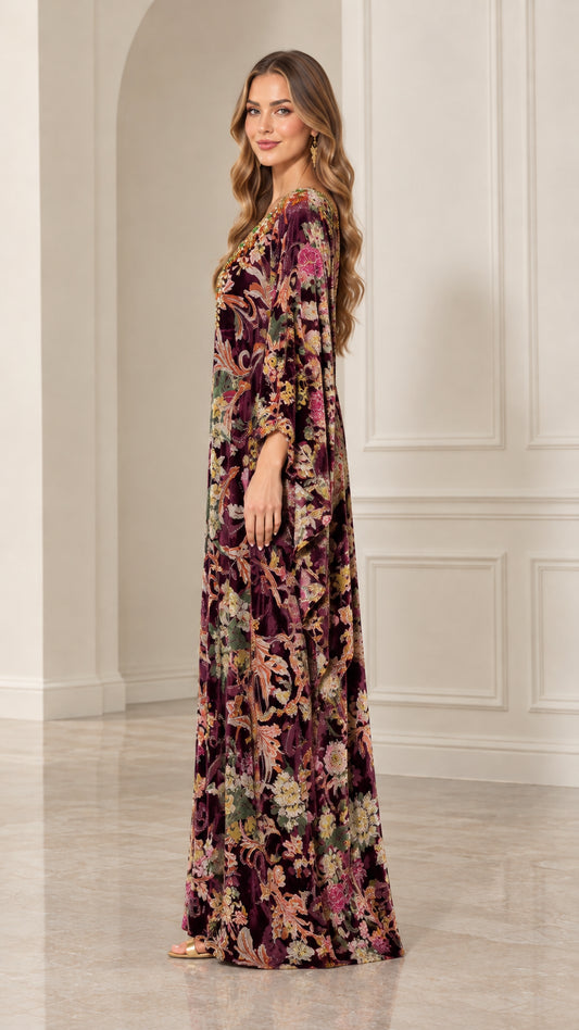 Side profile view of woman in Plum floral velvet kaftan dress